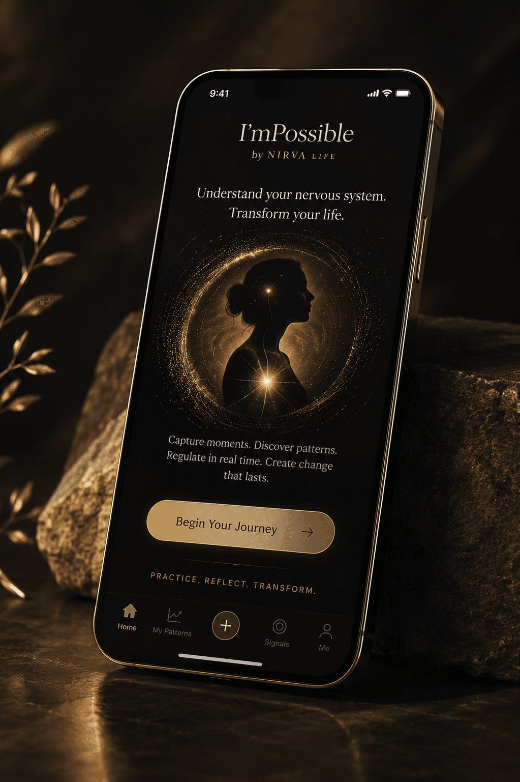 I’mPossible app open on iPhone resting on stone